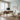 Stanley Furniture Horizon Mid-Century writing desk in a coastal home office with ocean view window, textured jute rug, swivel desk chair, and minimalist monitor setup creating a modern workspace.