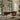 Stanley Furniture Horizon Mid-Century writing desk in a sophisticated home office with leather swivel chair, modern desk lamp, large windows, and built-in bookshelves overlooking a landscaped garden.